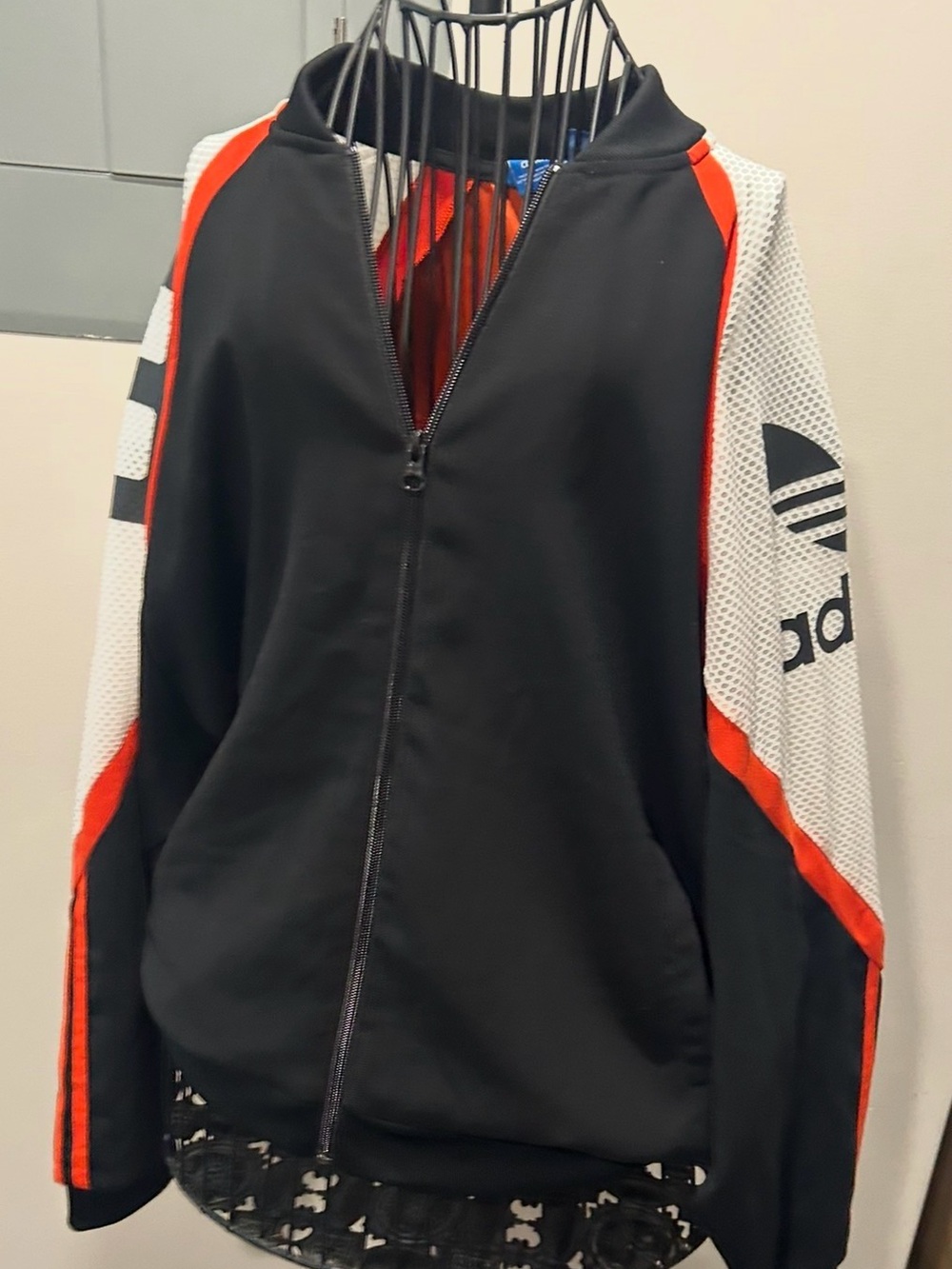 adidas Blue Logo Tag on Black Collar with Red Background